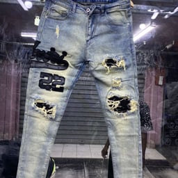 Product image for Distressed Blue Denim Jeans with Graphic Patches